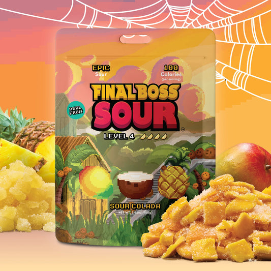 A bag of Final Boss Sour Level 4 Sour Colada candy is centered against a bright orange background with tropical fruit graphics and loose candy piles in the foreground.